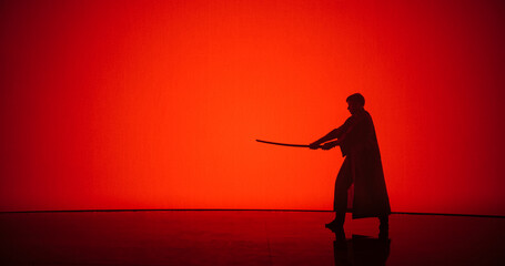 Athletic Man Practicing Kendo Martial Arts with a Katana or a Bamboo Sword. Male Does Cosplay,...