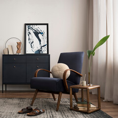 Elegant interior with mock up poster frame, blue armchair, commode, brown sofa, carpet, decoration, side table and personal accessories. Stylish home decor. Template.