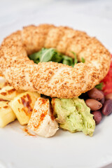Turkish breakfast with simit, cheese, tomato, cucumber, olives. Breakfast with coffee in the restaurant. Morning nutritious meal