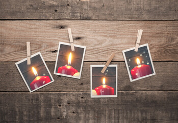 Four old photo frames with burning Advent candles