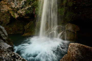 Obraz premium The Borosa River with its waterfalls, including La Calavera, in the Salto de los Órganos area, in the Cazorla, Segura and Las Villas mountains. Jaen. Andalusia. Spain.