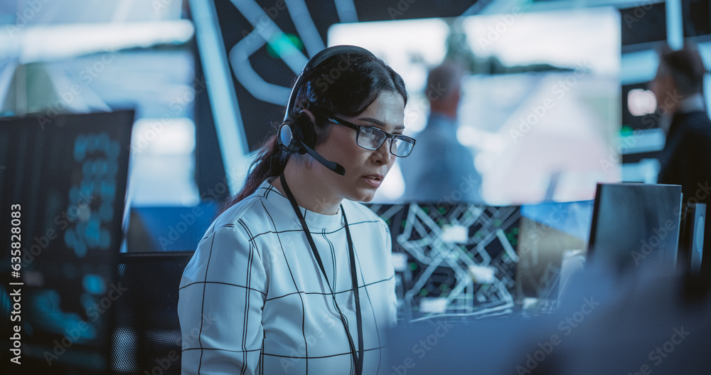 Fototapete portrait of a female fleet operator working in an office hub for order delivery, control and client 