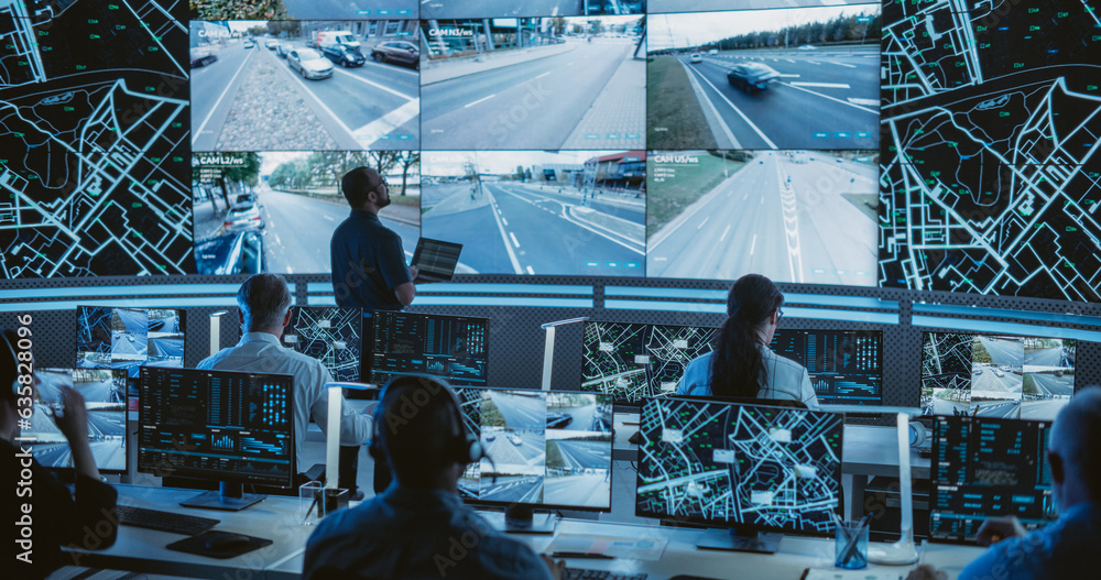 Poster Male Software Engineer Working on Laptop Next to a Big Screen in a Modern Monitoring Office with Live CCTV Footage with Traffic Situation. Monitoring Room With Big Data Engineers Work on Computers