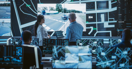 Diverse Team of Specialists Analyze Surveillance Feeds, Monitor Targets on a GPS City Map, Ensure...