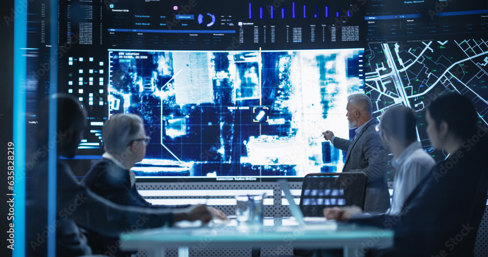 Poster team of surveillance experts having a discussion during a meeting in an advanced research center. di