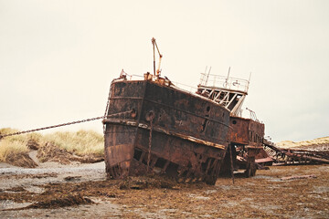 Shipwreck on the  coast of Magellan Strait, rusty warship wreck, Tierra Del Fuego, Chile © Natalia