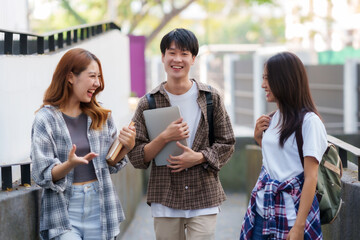 Group of Young Asian student walking and talking at university.