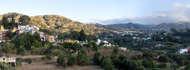 Panoramic photograph of the town of Santa Brígida, enclosed in a beautiful ravine surrounded by palm groves. Gran Canaria, Spain