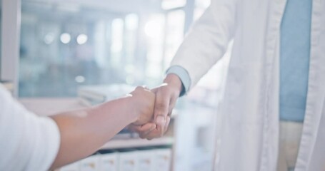 Person, doctor and handshake in meeting, partnership or deal agreement together at the hospital. Closeup of medical or healthcare professional shaking hands in greeting, introduction or thank you