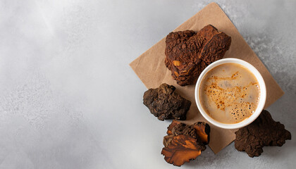 Organic Chaga mushroom coffee on light background. Top view. Horizontal. Copy space.