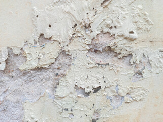 yellow wall backdrop with cracked paint peeling off