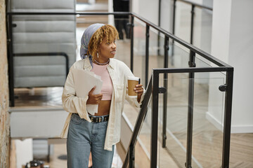 positive african american woman with braces holding papers, startup project, coworking, stairs