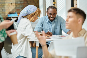 happy african american coworkers discussing project over graphs, coworking, start up, ideas