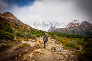 Beautiful nature of Patagonia. Fitz Roy trek, man with backpack walking, view of Andes mountains,...