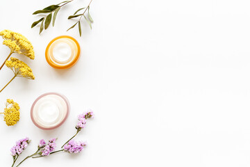 Skin care cosmetics product - cream for face or body with flowers