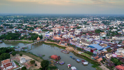 Fototapeta premium Aerial View landscape water flowing and life of thai people fishery, Aerial Drone View of Sakae Krang River and home villages near the river at Uthai Thani Province in Thailand