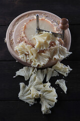 Slice the tete des Moines cheese with a girolle knife. A kind of Swiss semi-hard cheese. A special...