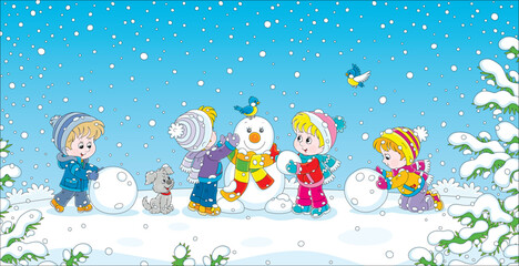 Obraz premium Happy little kids making big snow balls and sculpting a funny toy snowman with a colorful striped scarf on a beautiful winter day in a snowy park, vector cartoon illustration