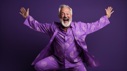 An elderly man in pajamas passionately spreads his arms out to the sides.