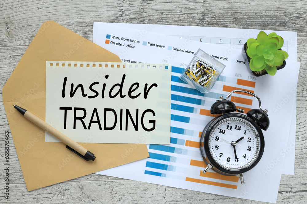 Poster insider trading text on the page. desktop. a table clock