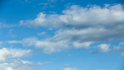 White clouds on blue sky, weather concept