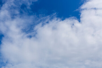 White clouds on blue sky, weather concept