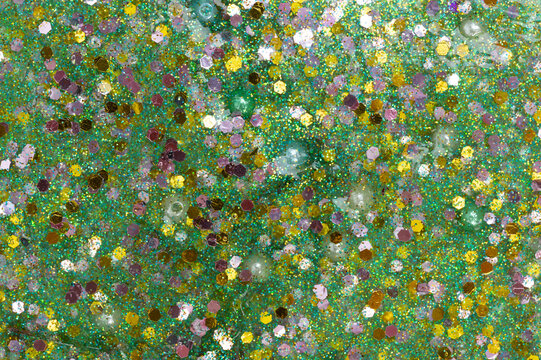 Glittery sparkles on green slime background