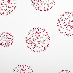 Square Christmas flat lay concept featuring red peppers creatively arranged in the shape of fireworks on a pristine white background