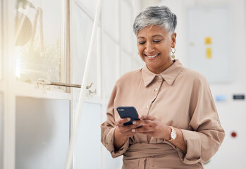 Senior woman, phone text and networking in a office with a smile and mobile planning for digital...
