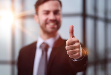 Close up Shoot of Lawyer Hand showing Thumbs Up in Court Room