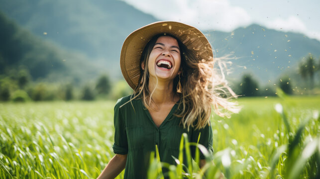 woman in a field wearing straw hat