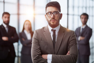 Business people stand on the background of the office corridor