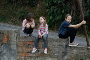 Fototapeta premium Kid girls quarreled. Children in park outdoor