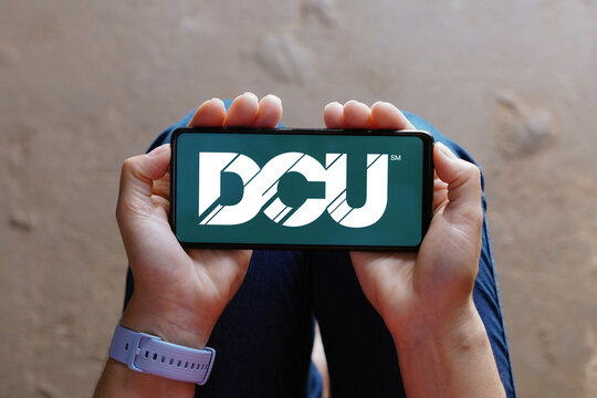 August 17, 2023, Brazil. In this photo illustration, the Digital Federal Credit Union (DCU) logo is displayed on a smartphone screen.