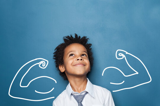 Naklejki Happy kid school boy portrait. Little child boy looking up on blue background