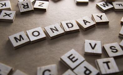 Monday word on wooden blocks. Wooden blocks with letters on vintage background