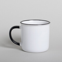 Mug mockup isolated on light gray background. White black blank cup for your design. Empty mockup template on a white table