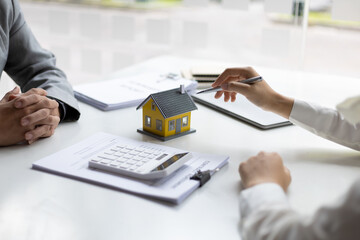 Businessmen, real estate agents discuss house purchase prices, fee, mortgage, interest, rent, cash...
