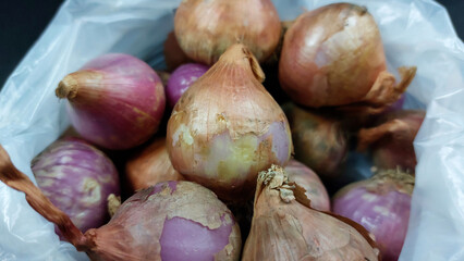 Macro photo.Fresh onion on black background
