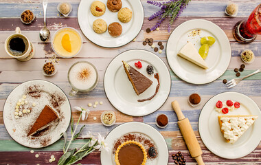 Dessert table with all kinds sweet snacks on wood background. table. Top view, flat lay