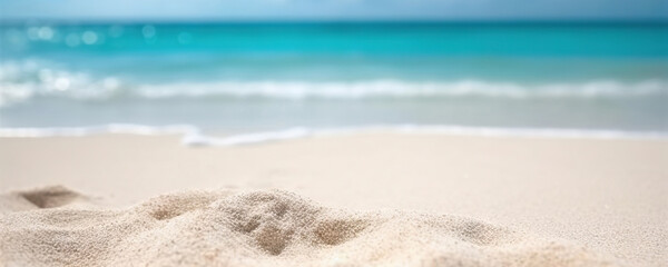 Fototapeta na wymiar White sandy beach on background of turquoise ocean and blue sky