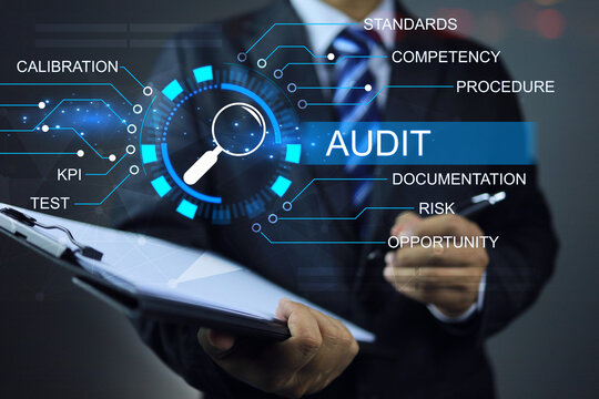 Auditor holding clipboard to audit factory annual assessment every year to ensure activities are conform to correct way, not against law and a plan to meet the quality standards KPI target ISO 9001