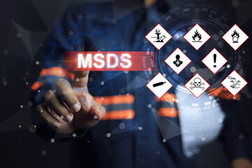 Safety staff pointing on the warning sign of hazardous substances material data, indicating prepare...