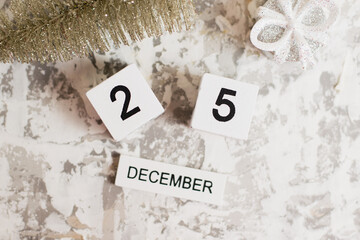 Flatlay, Christmas decor and wooden calendar with date December 25 on light background, Christmas. The concept of preparing for the celebration of Christmas and New Year and plans for the future.