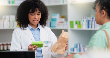 Concerned pharmacist assisting an upset and angry customer in a local pharmacy. Female client...