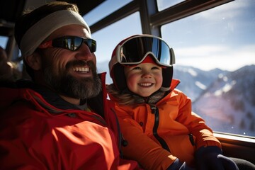 Father and son on a ski chairlift going up the mountain at a ski center getting ready to go skiing and snowboarding