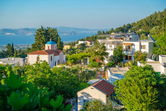 View of Greek Orthodox Church with sea in background, Zia Village, Kos Town, Kos, Dodecanese, Greek Islands, Greece
