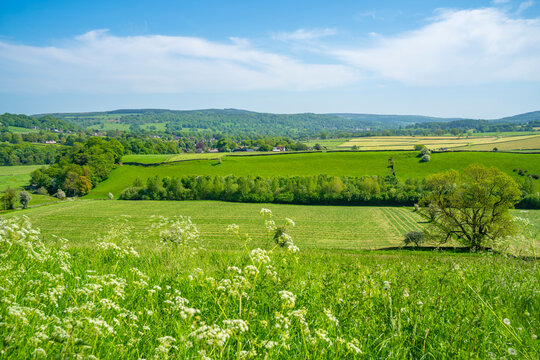 View of farmland and Baslow village during spring, Peak District National Park, Derbyshire, England, United Kingdom