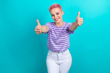 Photo of pretty friendly person toothy smile hands fingers demonstrate thumb up isolated on teal color background