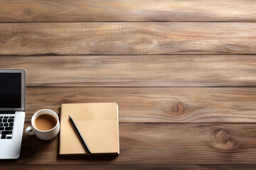 Modern workplace with laptop, notepad and coffee cup on wooden table top view background. High quality photo